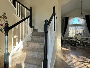 Elegant staircase with a fresh coat of paint by Plata Painting co Roseville CA